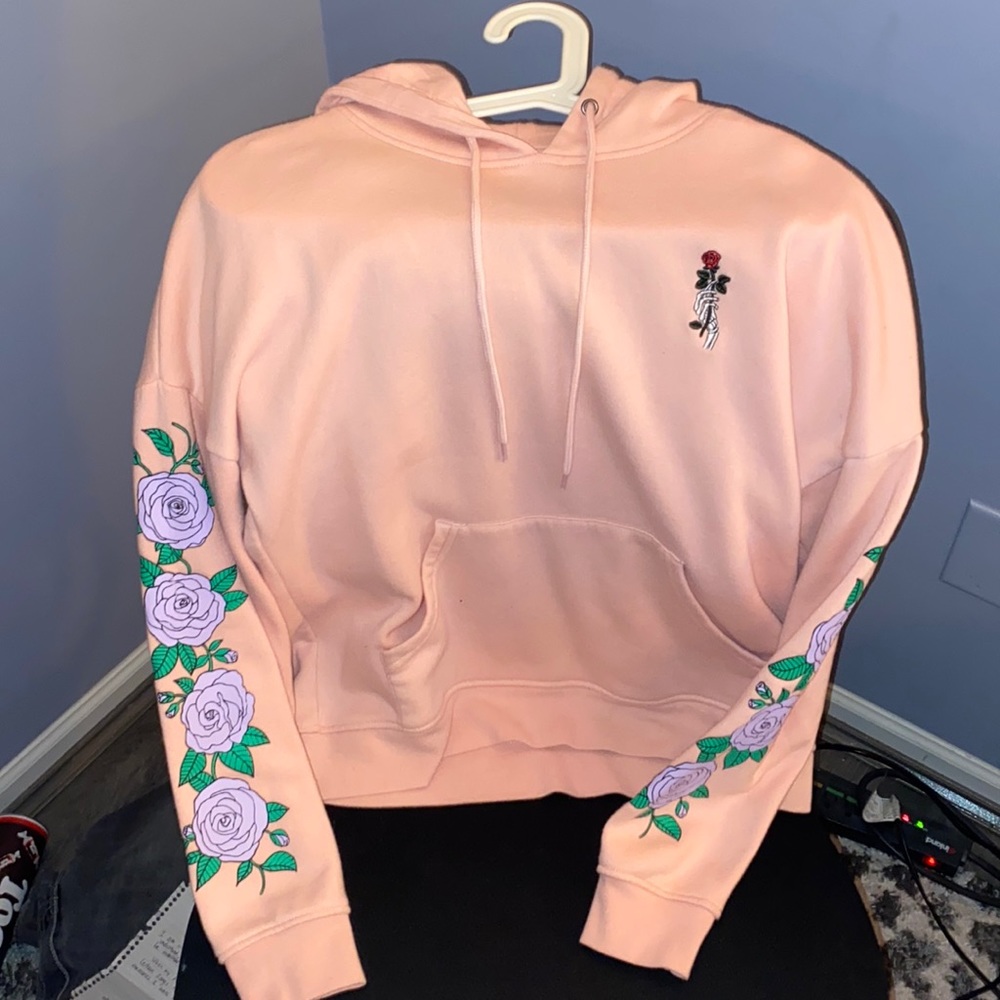 Zumiez pink sweatshirt with purple roses and skeleton hand holding red rose